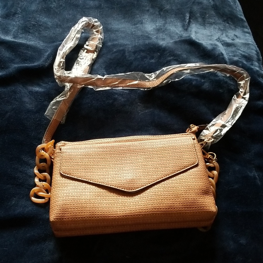 Purse with removable strap t o use as clutch. 10 inches wide by 7 inches height.